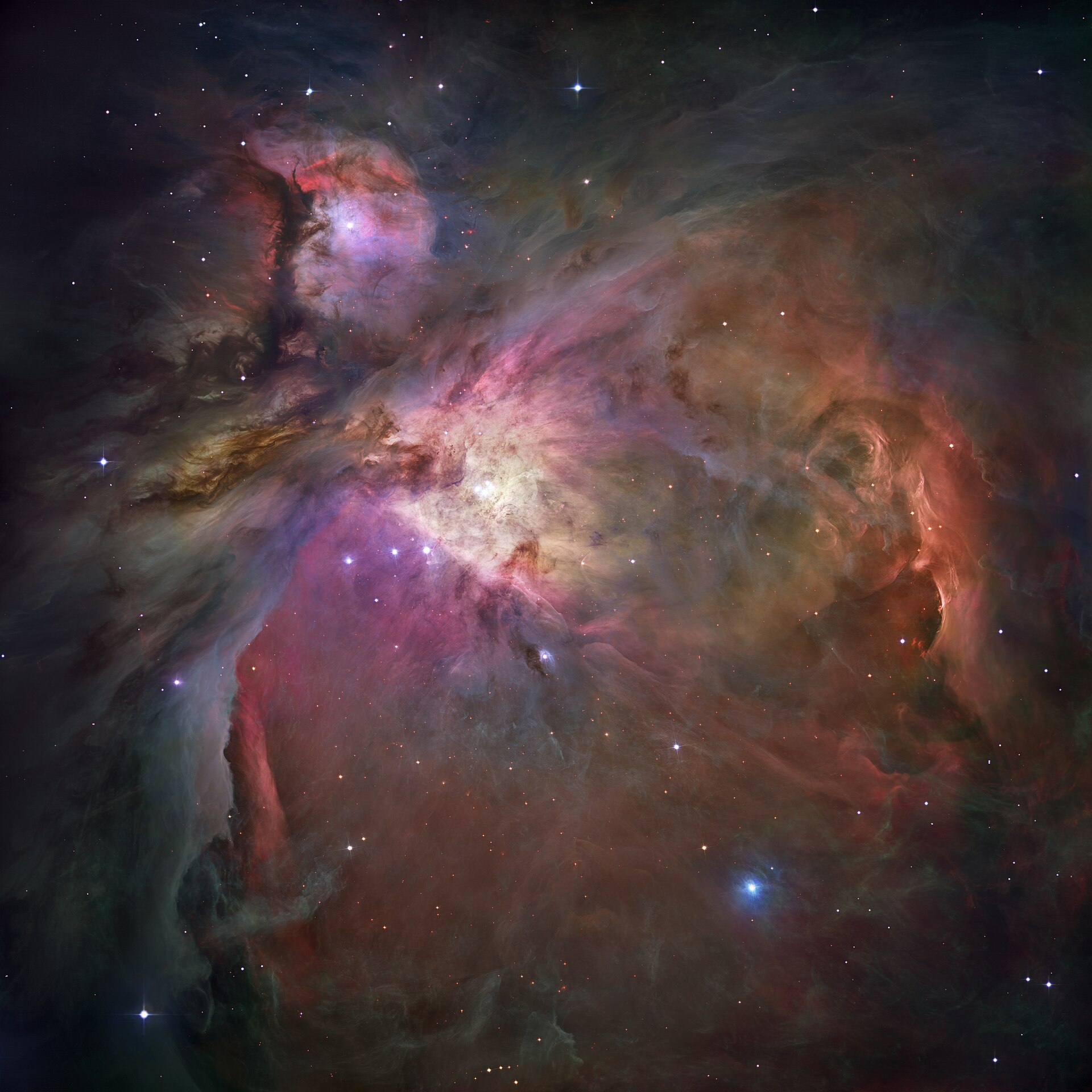 The Orion Nebula: a cavern of gas and dust with young stars forming in the center. Hubble ACS mosaic with ESO ground-based fill.