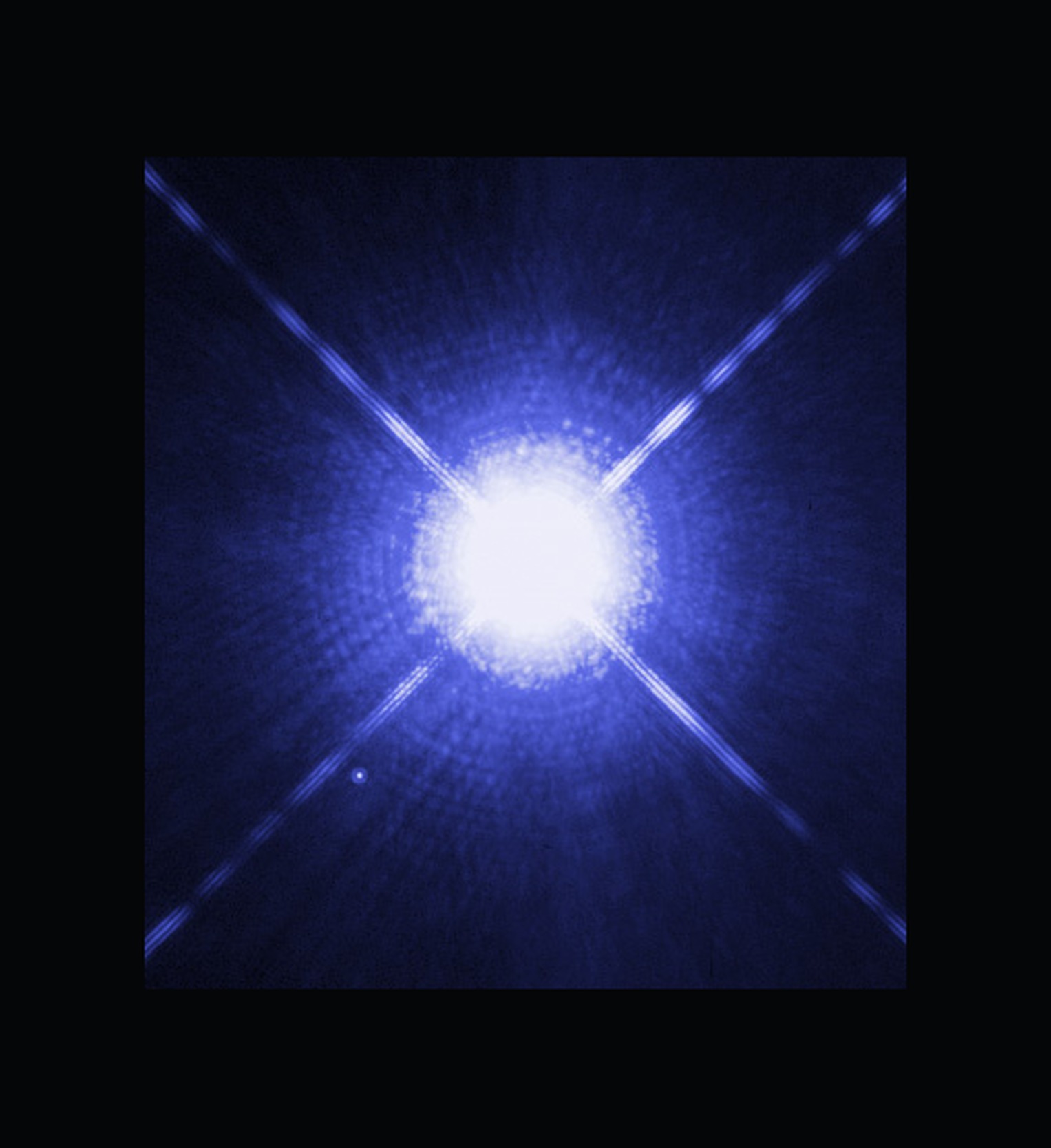 A tightly cropped Hubble image of Sirius A, an overwhelming lamp with diffraction spikes. No companion is visible in this crop.
