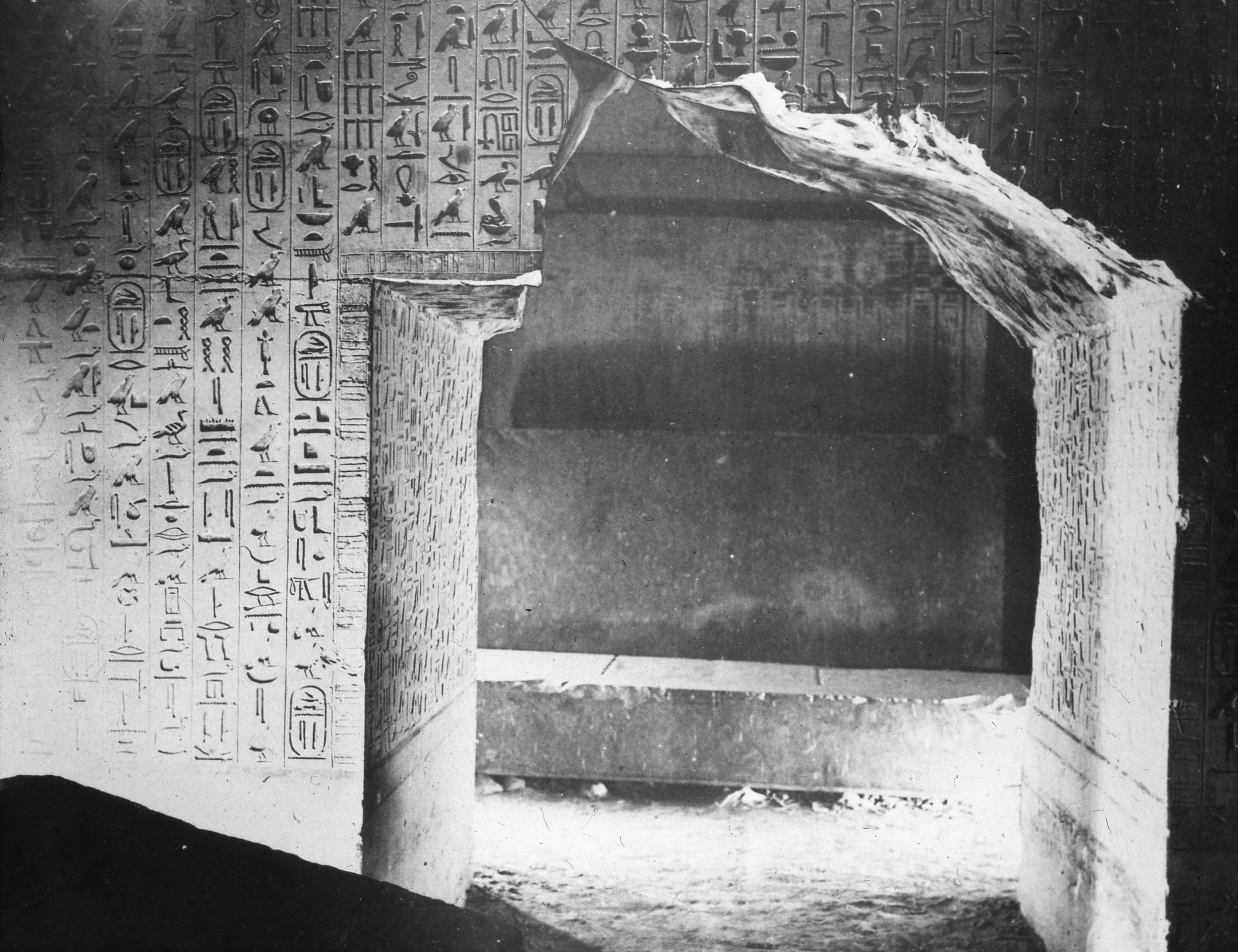 Lantern slide of a burial chamber in the pyramid of Unas at Saqqara, walls inscribed with Pyramid Texts.